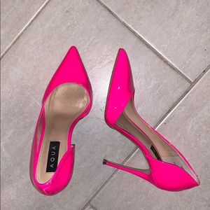 Neon pink patent pumps